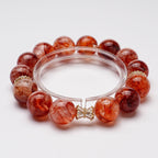 Natural red flower crystal bracelet close up showing unique hematite inclusions gold accent beads Taoist KaiGuang consecrated