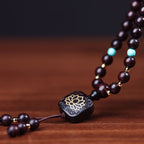 High-density purple-black sandalwood beads for flow state activation.