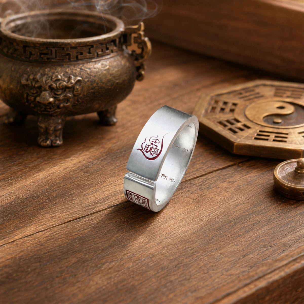 Close-up of a Taoist wealth attraction ring showing the inner Celestial Master Seal and hand-finished silver surface.