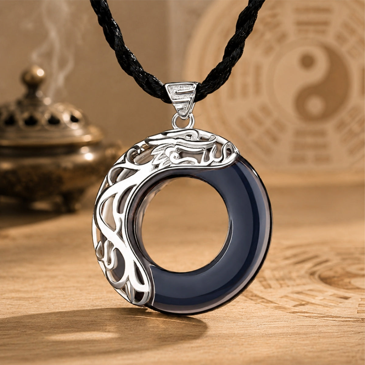 Dark jade koi love necklace with sterling silver koi detailing and a round jade pendant design.