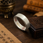 Taoist four-talisman protection ring with hidden inner engravings, cinnabar talisman details, and gold-tone accents