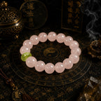 Heart healing bracelet for women with pink crystal beads displayed in a Taoist KaiGuang setting