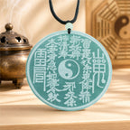 Natural blue-green jade Shan Gui coin pendant for Taoist protection, evil warding, and daily safeguarding.