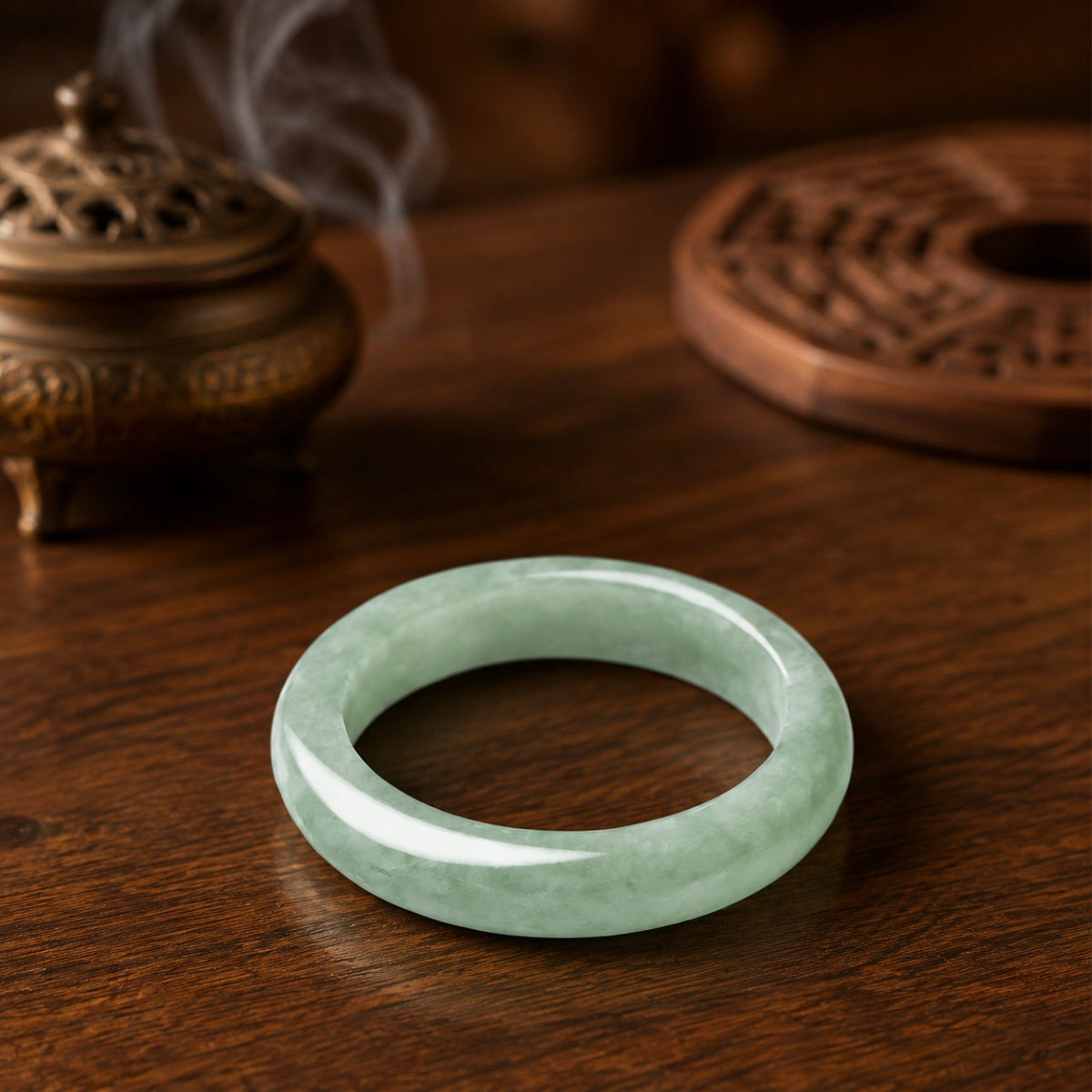 Polished natural green jadeite ring shown from above with its translucent jade texture.
