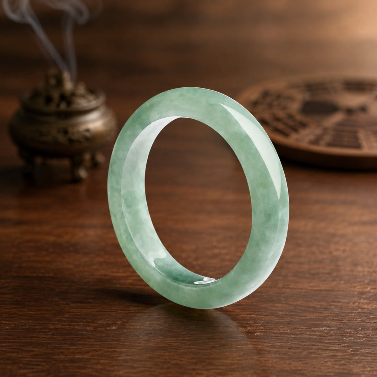 Natural green jadeite ring with unique jade patterns for Taoist wealth attraction and protection.
