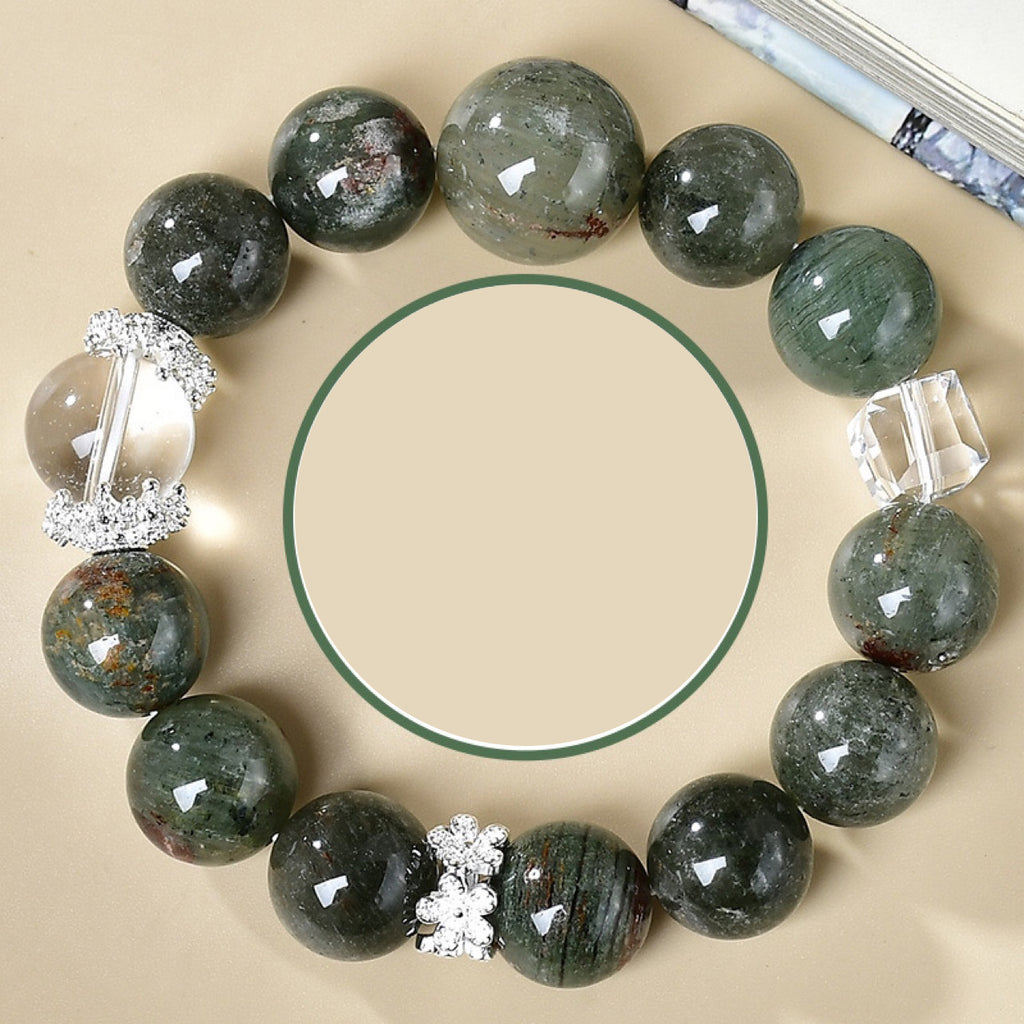 Full top view of a Taoist career success energy bracelet with large green crystal and clear quartz beads