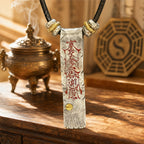 925 sterling silver Taoist dual-sided protection and fortune talisman pendant with red cinnabar front inscription and black cord.