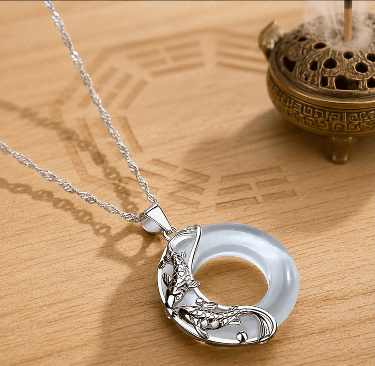 Natural white jade koi love necklace with a sterling silver koi design on a fine silver chain.