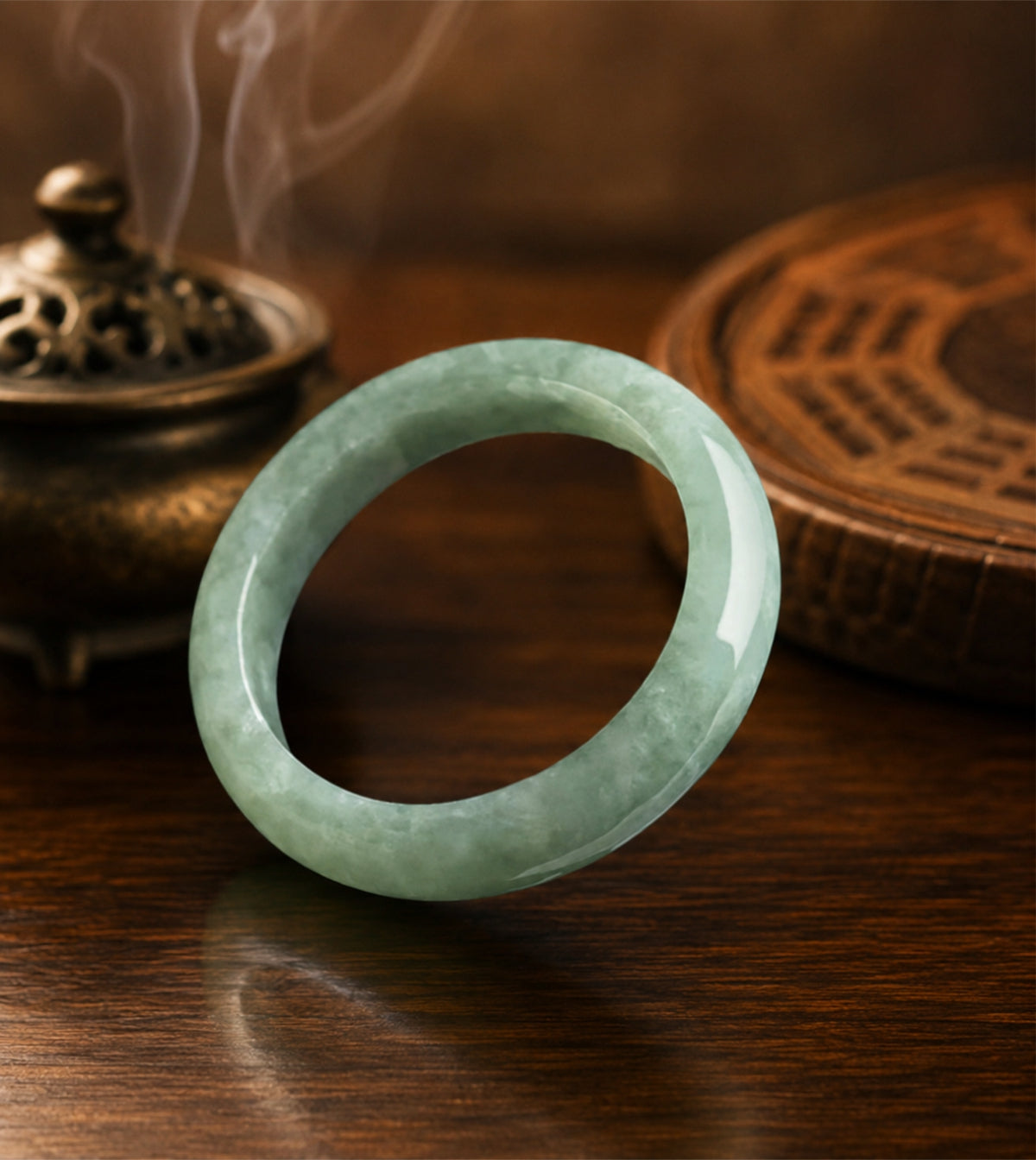 Natural green jadeite Taoist wealth attraction ring with smooth polished finish.