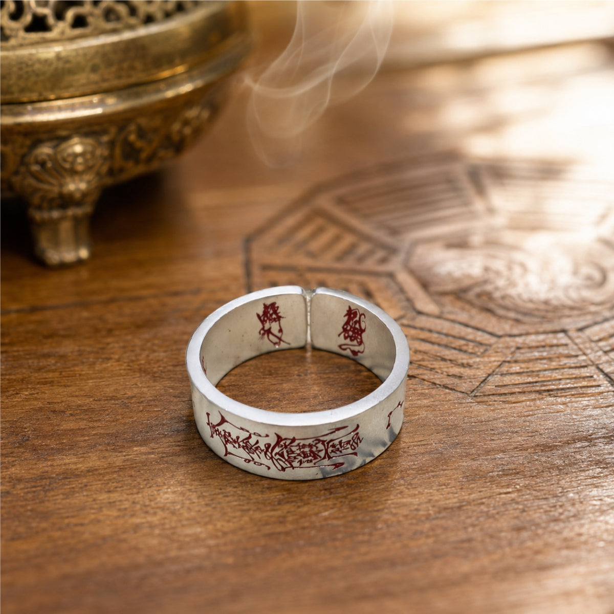 Open 925 silver Taoist protection ring showing red cinnabar talisman engraving and inner protective seal details.
