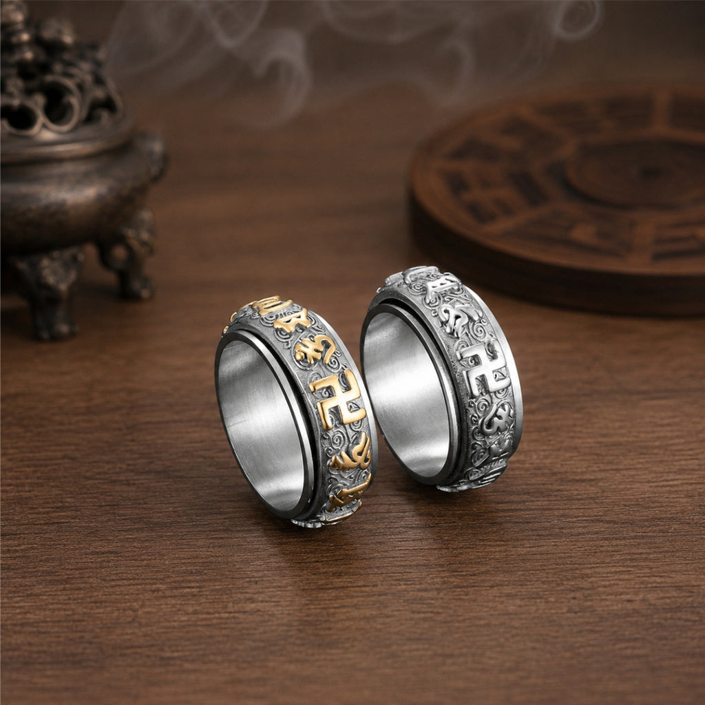 Silver and gold-tone Taoist protection spinner ring variants with engraved talisman-style symbols.