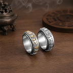 Silver and gold-tone Taoist protection spinner ring variants with engraved talisman-style symbols.