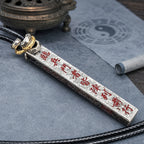 Hand-finished silver Taoist supreme protection and fortune talisman pendant with red cinnabar inscriptions and black cord.