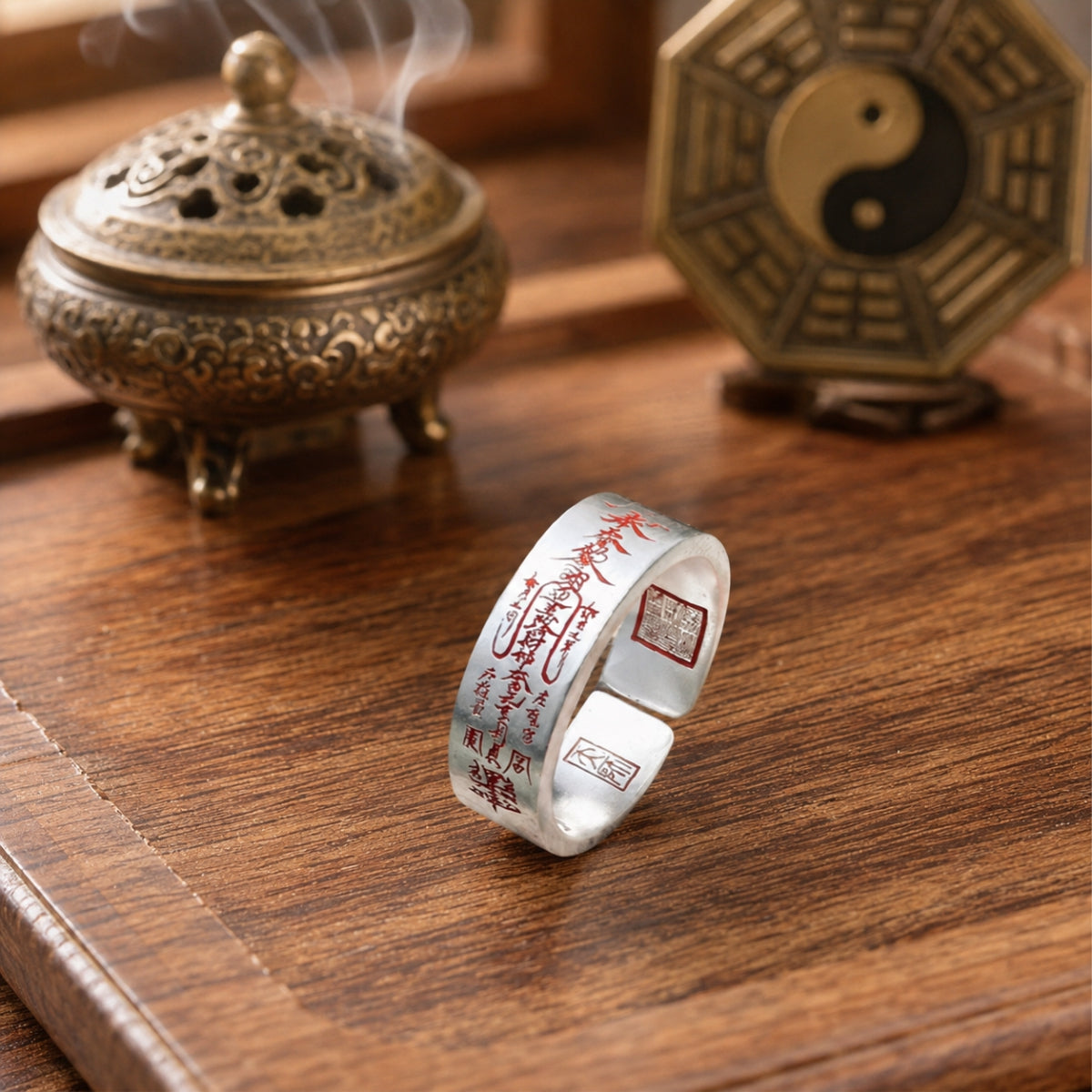 Handcrafted 925 silver Taoist wealth attraction ring showing the outer wealth talisman and inner Celestial Master Seal.