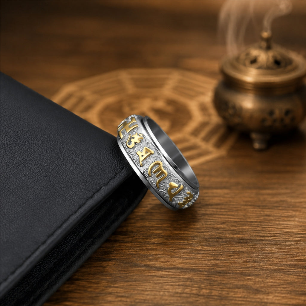 Taoist spinner ring with gold-tone auspicious character details, designed for protection and wealth attraction.
