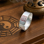 Taoist wealth attraction ring with a red cinnabar Five-Way Wealth Seal and inner Celestial Master Seal.