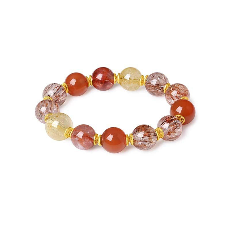 Side view of a women’s good luck energy bracelet with red and transparent natural beads