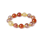 Side view of a women’s good luck energy bracelet with red and transparent natural beads