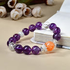 Amethyst crown chakra bracelet 11mm beads strawberry quartz focal bead silver crown spacers side view cream white background intuition enhancement KaiGuang