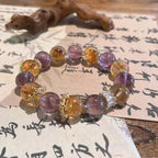 Ametrine crystal anxiety relief bracelet with amethyst citrine beads and gold spacers on traditional Chinese calligraphy paper with wooden carving Taoist KaiGuang deep sleep calm