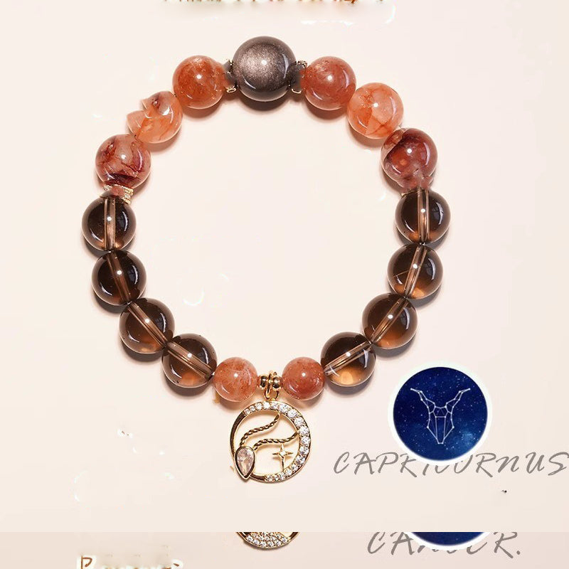 Capricorn zodiac strawberry quartz and smoky quartz crystal healing bracelet with black metal bead and gold goat constellation charm Taoist KaiGuang manifestation spiritual jewelry