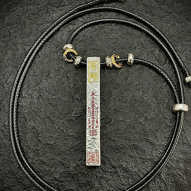 Macro detail of the main front engraving with sacred cinnabar. Includes the Celestial Master Seal for forceful luck alignment and wealth attraction.