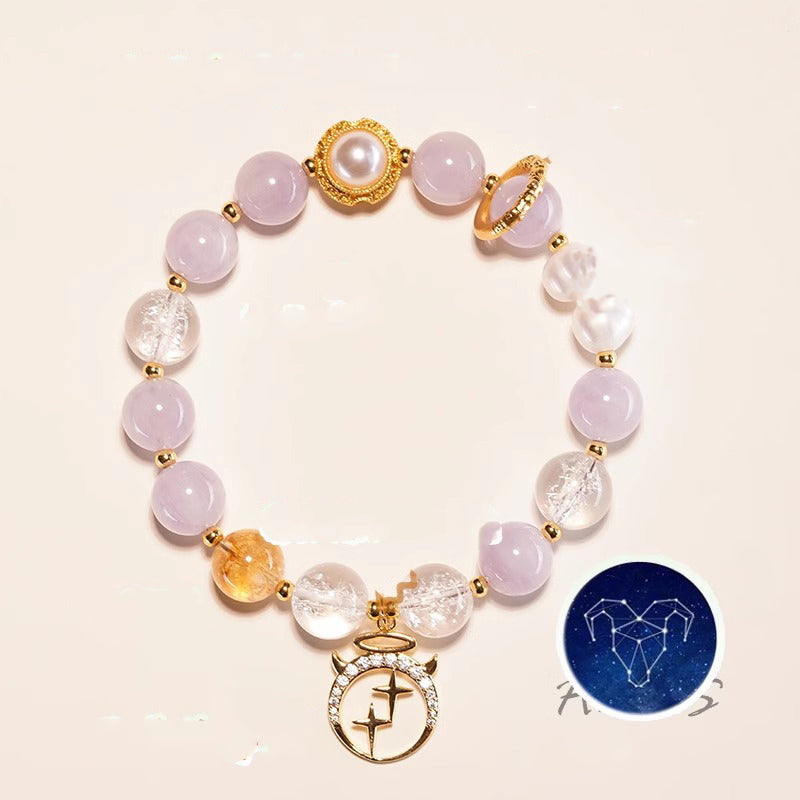 A high-energy multi-stone bracelet featuring rose quartz and citrine with a gold zodiac charm.
