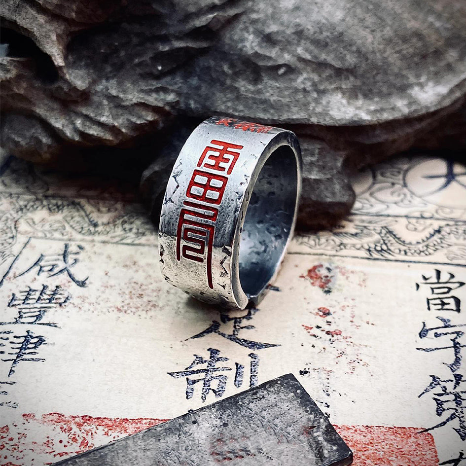 Close-up on the cinnabar-activated Five-Thunder Talisman, symbolizing the purest Yang force for active evil-banishment and grounding.
