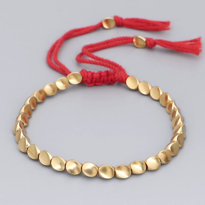 copper bead bracelet women taoist kaiguang wealth attraction gold beads red rope tassel detail white background
