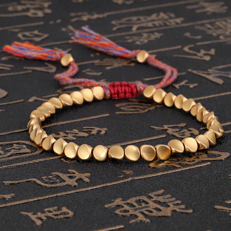 copper bead bracelet women taoist kaiguang wealth love aura gold beads red rope calligraphy background