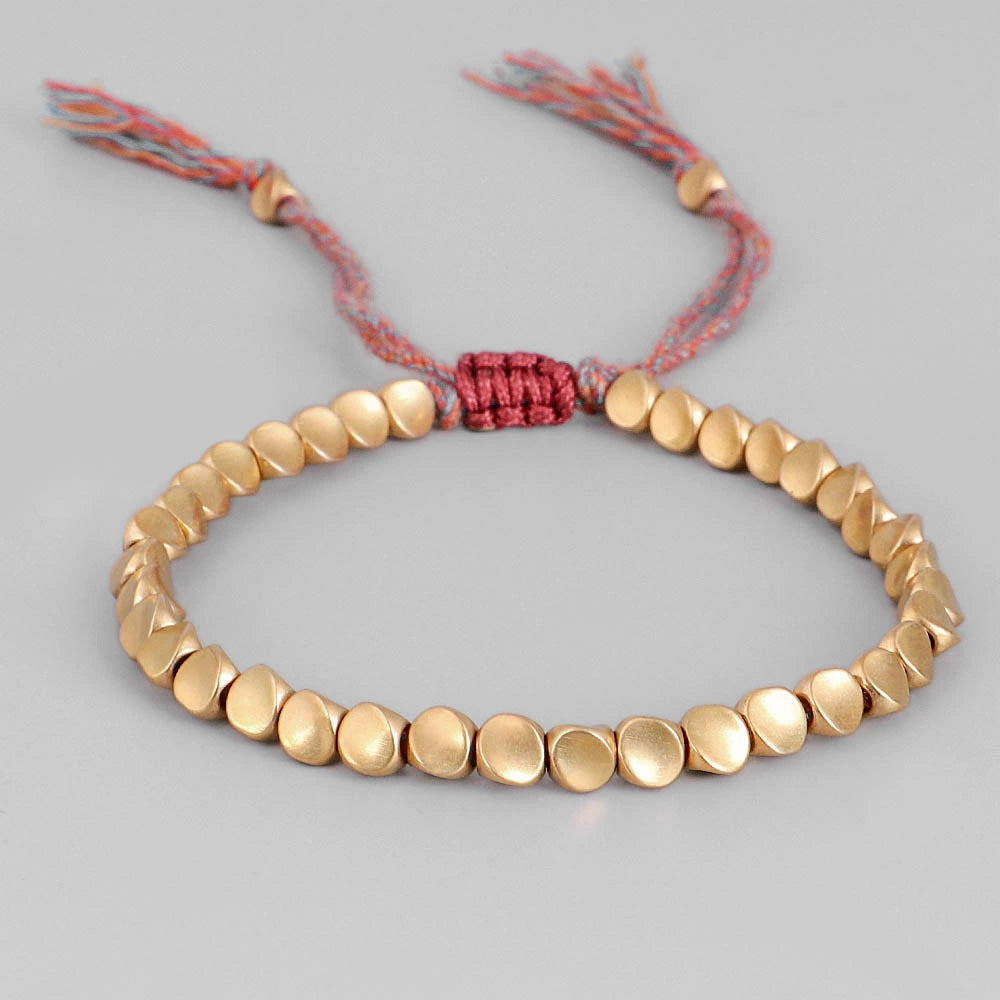 copper bead bracelet women taoist kaiguang wealth love aura gold beads flat lay display white background