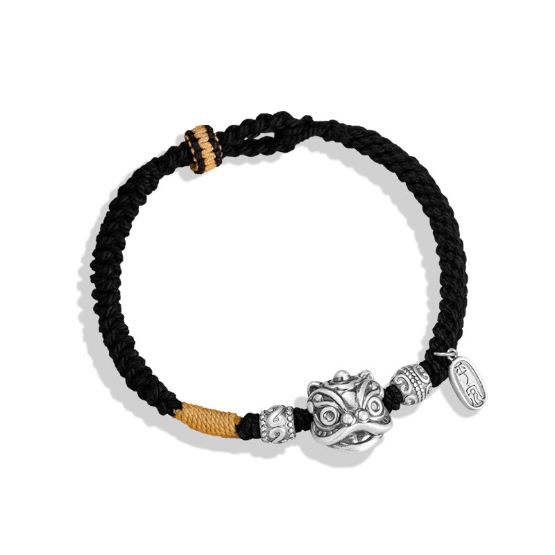 Black and gold braided cord men love protection bracelet with silver lion head charm rune beads and oval tag on white background Taoist KaiGuang guardian jewelry