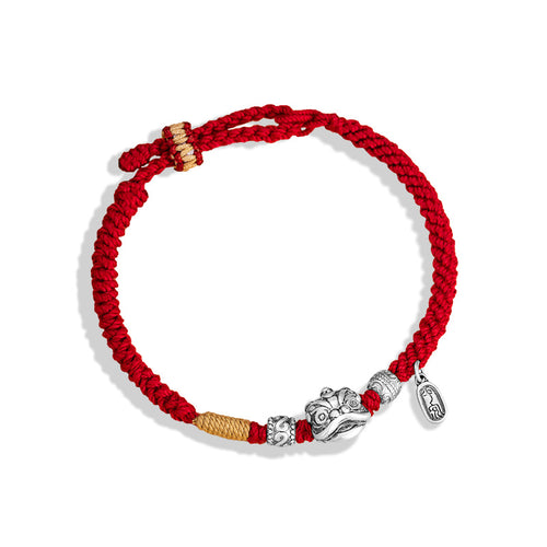  Red and gold braided cord love protection bracelet with silver lion head charm rune beads and oval tag on white background Taoist KaiGuang couple jewelry