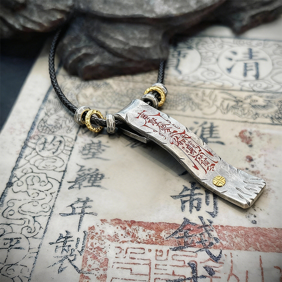 A clear flat-lay view showcasing the handcrafted 925 sterling silver texture of the dual-sided protection and fortune artifact.