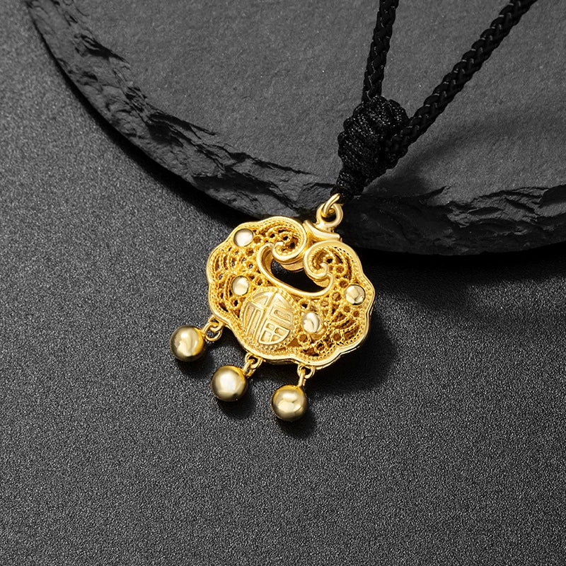Eastern peace lock pendant gold plated auspicious cloud filigree Fu character with three gold bead tassel on dark stone Taoist KaiGuang guardian