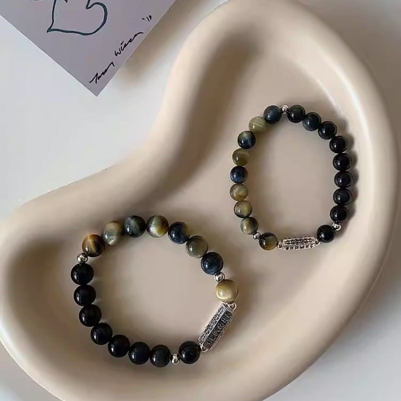 Pair of Feng Shui Taoist Kaiguang energy bracelets for love protection and attraction displayed as premium gift set