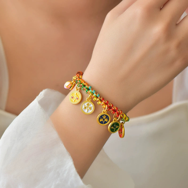 Five Gods of Wealth bracelet worn on woman wrist colorful braided rope gold medallion charms fortune jewelry lifestyle