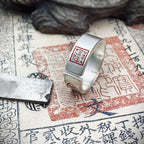 detailed engraving of five-way wealth god symbol on ring for attracting wealth from multiple sources