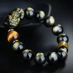 Gold obsidian Pixiu wealth bracelet with tiger eye bead and gold rune barrel on black silk