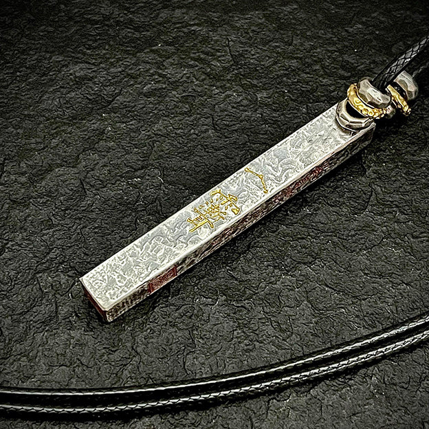Detailed shot of the Golden Evil-Banishing Talisman, specifically designed for high-frequency defense and negative entity purging.