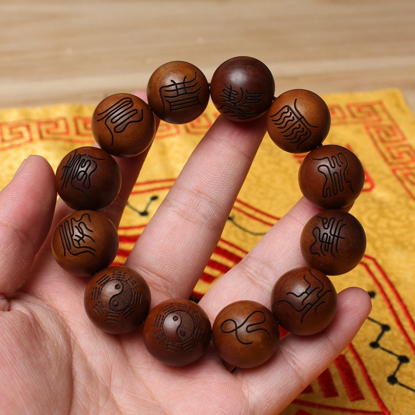 An elevated angle view of the heavy-duty 2.0cm thunderstruck wood bracelet, arranged in a perfect ring on a dark wooden podium, showcasing the full 12-bead matrix for aura defense.