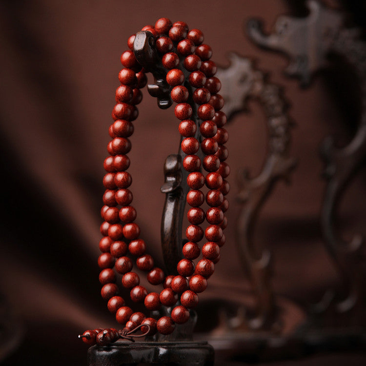 High-density aged rosewood beads for anchoring Qi flow and spiritual grounding.