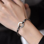 Man wearing Taoist KaiGuang jade peace buckle protection bracelet — evil warding amulet wrist wear