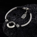 Taoist KaiGuang jade peace buckle protection bracelet — evil warding amulet on natural stone display