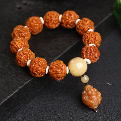 Close-up of the rich red texture of protective walnut beads for long life.