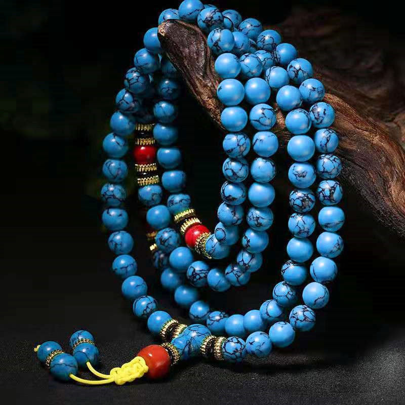 Full view of 108 blue turquoise prayer beads consecrated at Longhu Mountain.