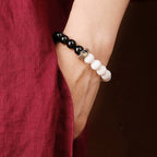 man wearing black obsidian yin yang tai chi bracelet taoist kaiguang spiritual protection men