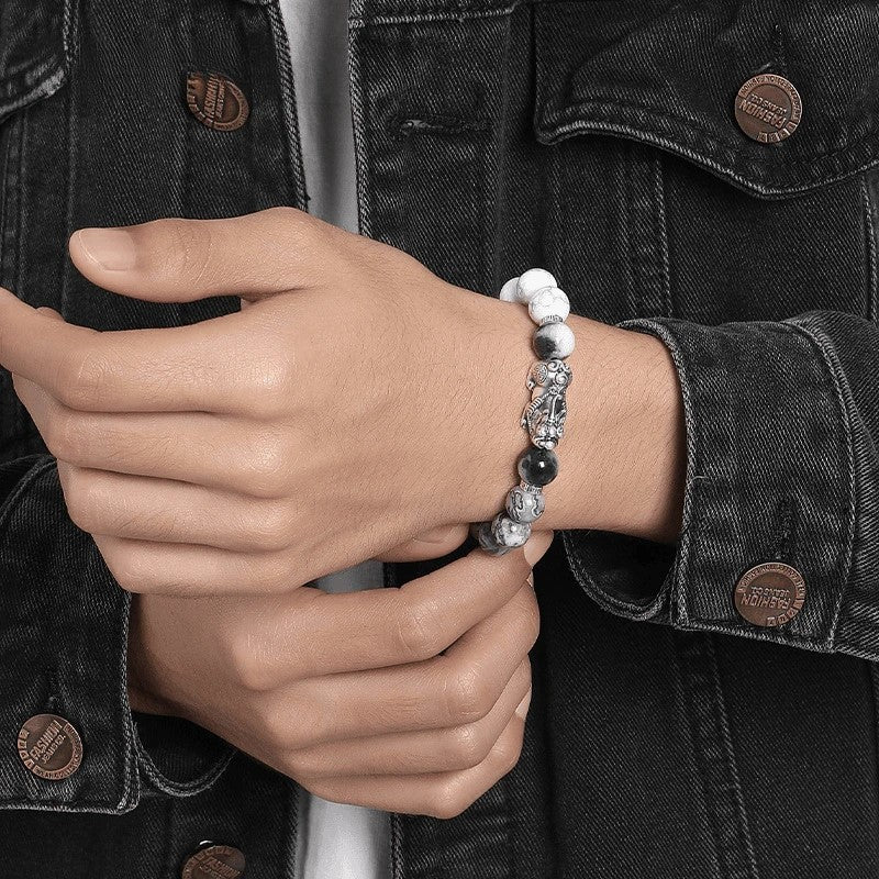 man wearing map stone pixiu bracelet wrist taoist kaiguang wealth fortune career success dark jacket