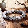 natural map stone pixiu bracelet taoist kaiguang wealth fortune career success vintage wood background