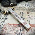 A scene shot of the six-sided Taoist Master Seal Amulet on vintage paper, representing authentic lineage and supreme authority.